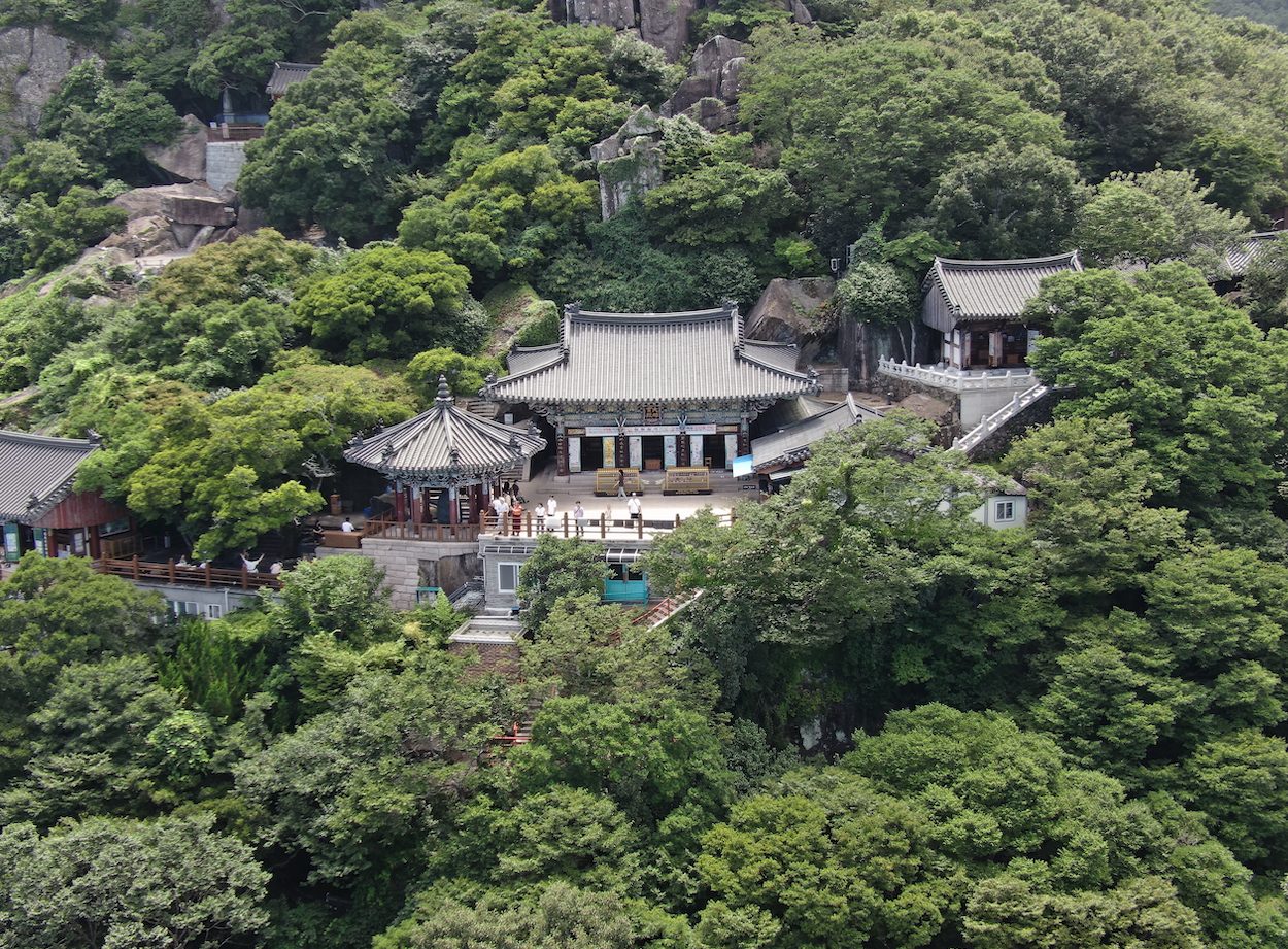 Hyangiram hermitage on a forested peak above the southern sea